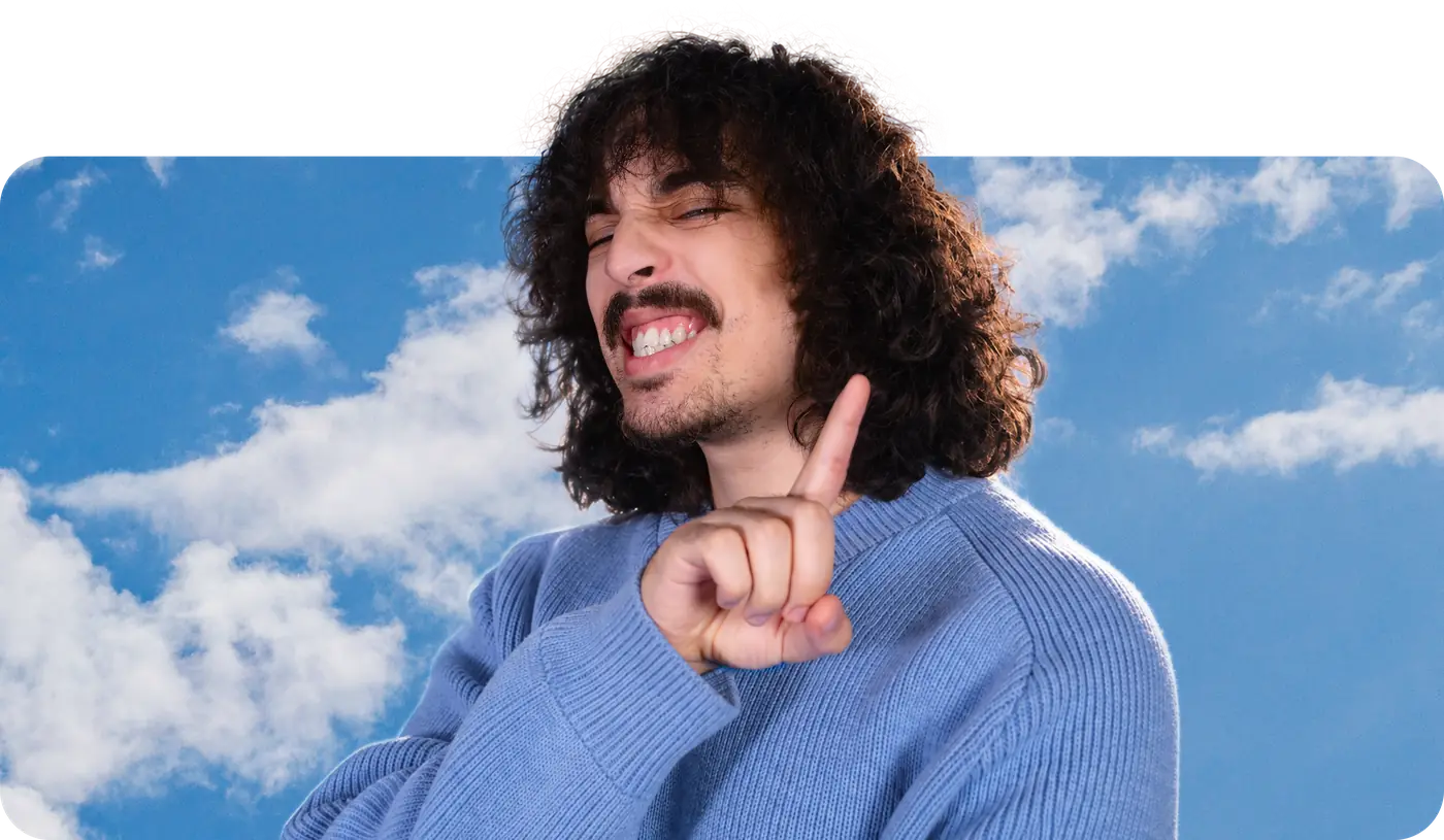 aura dies in a blue knit sweater, grinning and pointing up, leaning out of a frame of blue sky and white clouds